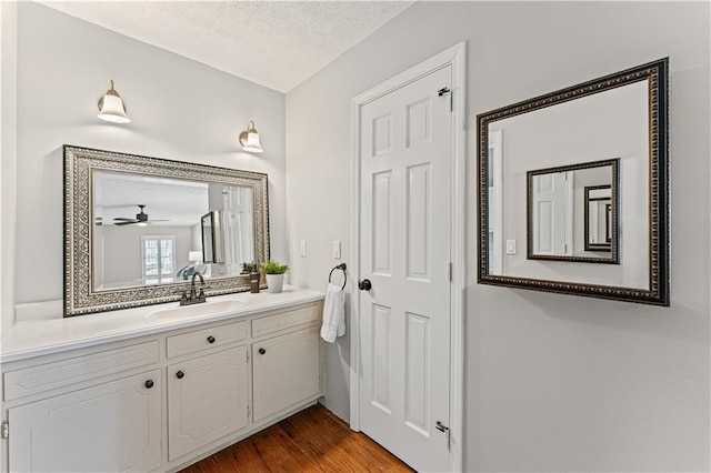 220 Hollyridge Dr, Roswell, GA 30076 - bathroom with vanity, a textured ceiling, wood finished floors, and ceiling fan