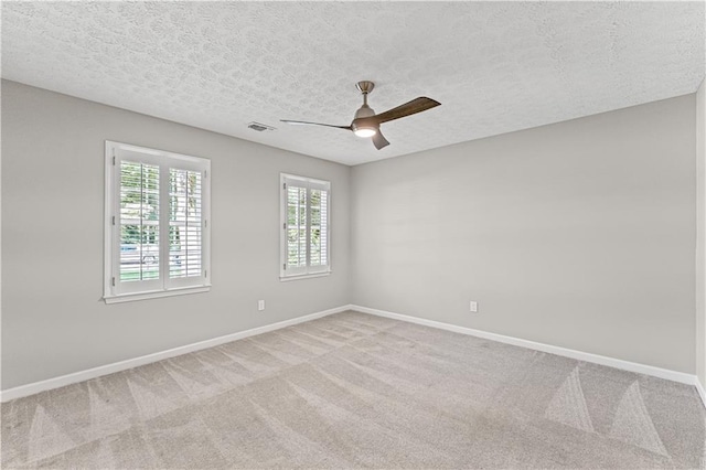 220 Hollyridge Dr, Roswell, GA 30076 - unfurnished room with ceiling fan, light colored carpet, and a textured ceiling