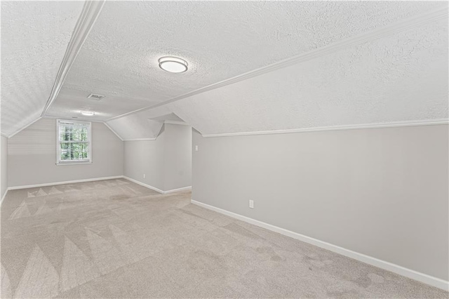 220 Hollyridge Dr, Roswell, GA 30076 - bonus room with a textured ceiling, lofted ceiling, and carpet flooring