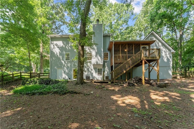 220 Hollyridge Dr, Roswell, GA 30076 - rear view of house with a sunroom, a chimney, and stairway