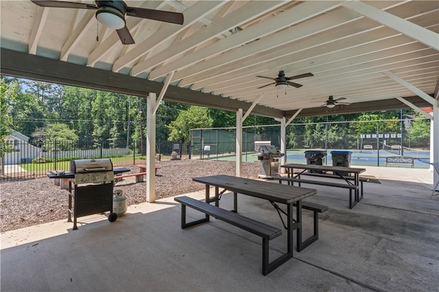 220 Hollyridge Dr, Roswell, GA 30076 - fenced backyard featuring a ceiling fan, grilling area, a patio, and outdoor dining space