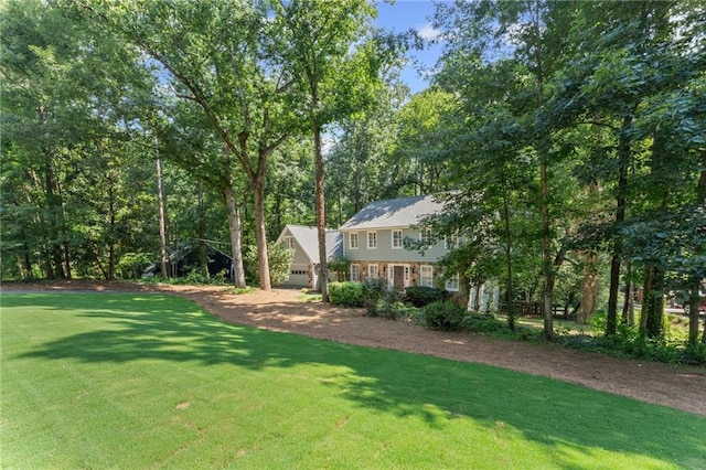 220 Hollyridge Dr, Roswell, GA 30076 - view of grassy yard with dirt driveway and an attached garage