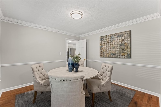 220 Hollyridge Dr, Roswell, GA 30076 - dining area with wood finished floors, a textured ceiling, and crown molding