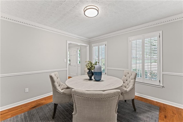 220 Hollyridge Dr, Roswell, GA 30076 - dining room with a textured ceiling, ornamental molding, and wood finished floors
