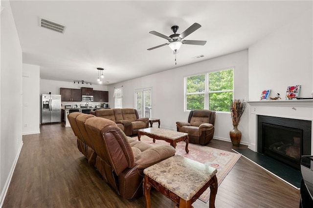 105 Arbor Creek Trl, Dallas, GA 30157 - living area featuring dark wood finished floors, baseboards, and a fireplace