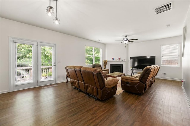 105 Arbor Creek Trl, Dallas, GA 30157 - living room featuring a ceiling fan, dark wood-style flooring, baseboards, and a fireplace