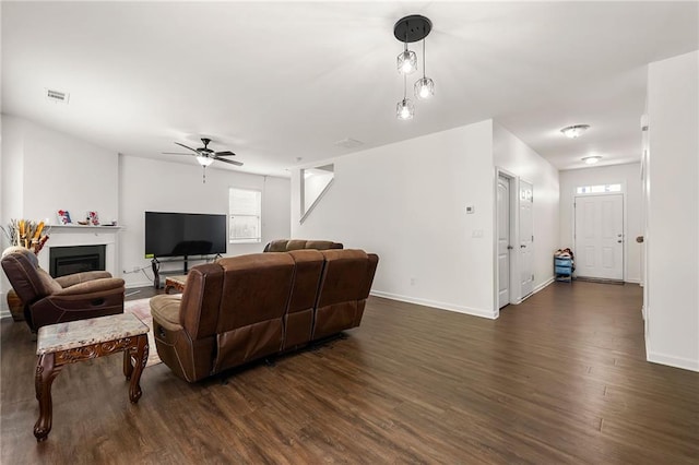 105 Arbor Creek Trl, Dallas, GA 30157 - living room with ceiling fan, dark wood-style flooring, baseboards, and a fireplace