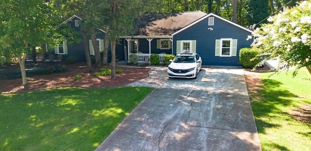 ranch-style house featuring a porch and a front lawn