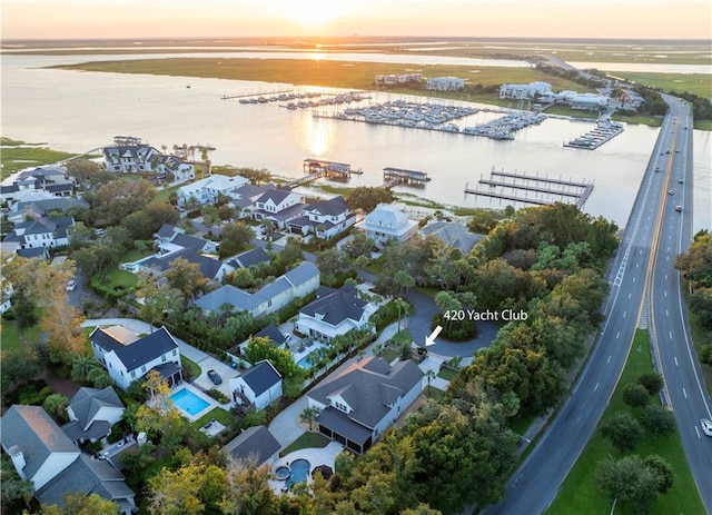 aerial view at dusk with a water view