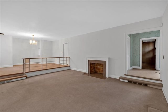 interior space with carpet flooring, baseboards, and a fireplace with flush hearth