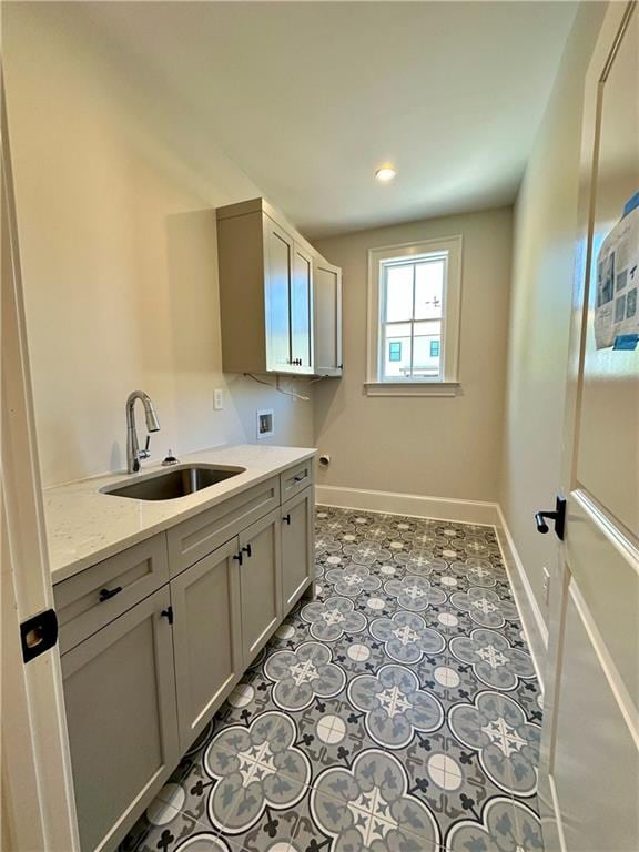 laundry room with sink, cabinets, tile flooring, and hookup for a washing machine