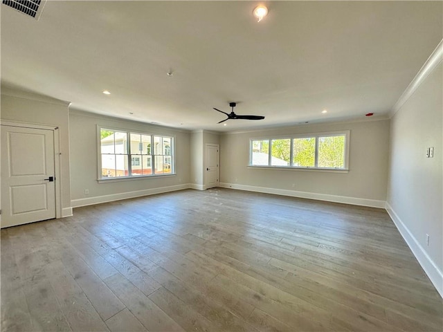 unfurnished room featuring crown molding, ceiling fan, and light hardwood / wood-style flooring