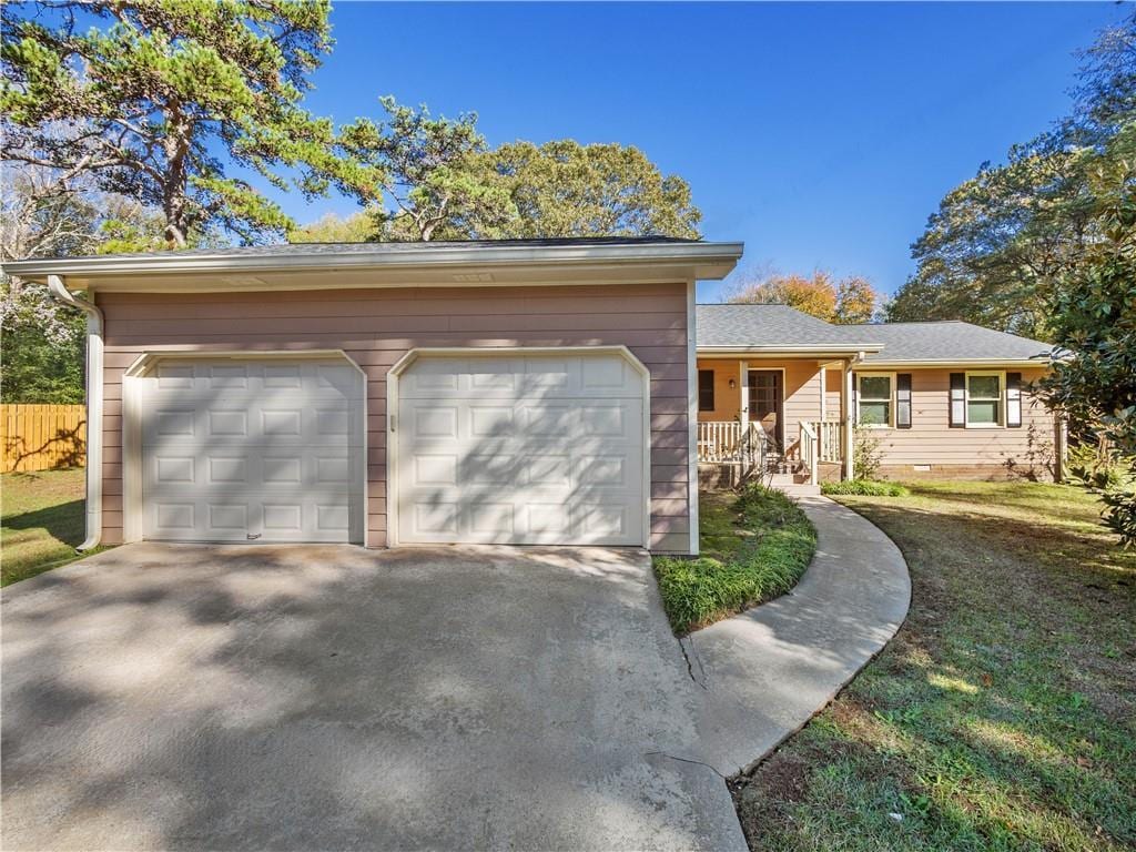 single story home with a front lawn and a garage