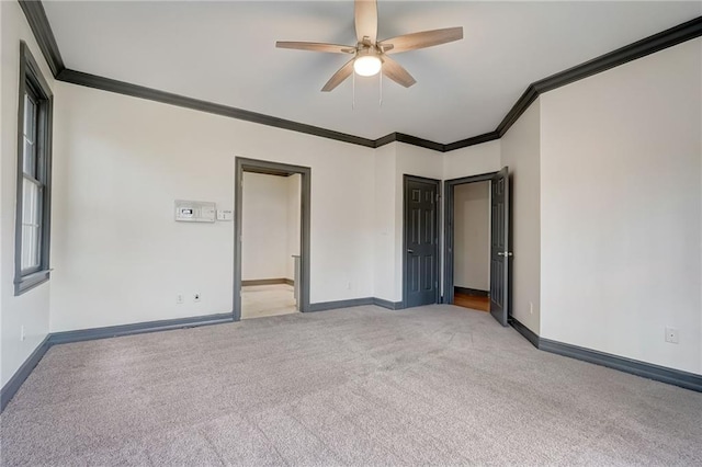 unfurnished bedroom with light colored carpet, ceiling fan, and crown molding