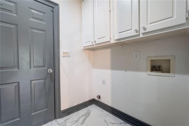 laundry area with washer hookup and cabinets