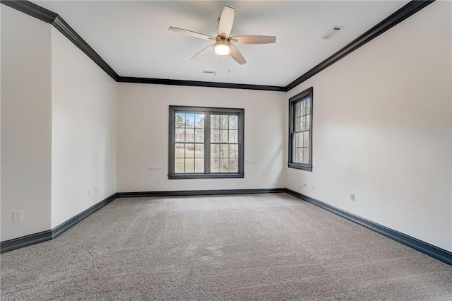 carpeted empty room featuring ornamental molding and ceiling fan