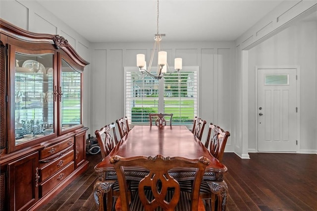 777 Tucker Trl, Bremen, GA 30110 - dining space with a decorative wall, a chandelier, dark wood-type flooring, and plenty of natural light