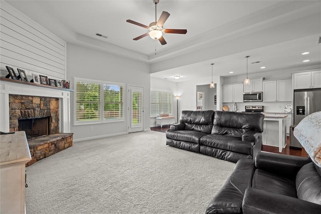 777 Tucker Trl, Bremen, GA 30110 - living room with ceiling fan, carpet, recessed lighting, baseboards, and a stone fireplace