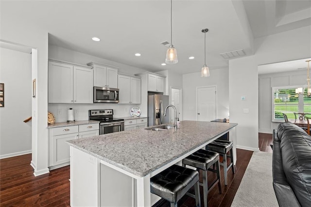 777 Tucker Trl, Bremen, GA 30110 - kitchen featuring appliances with stainless steel finishes, a sink, an island with sink, dark wood finished floors, and recessed lighting