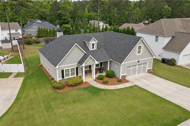 777 Tucker Trl, Bremen, GA 30110 - craftsman house featuring concrete driveway, stone siding, covered porch, a shingled roof, and a chimney