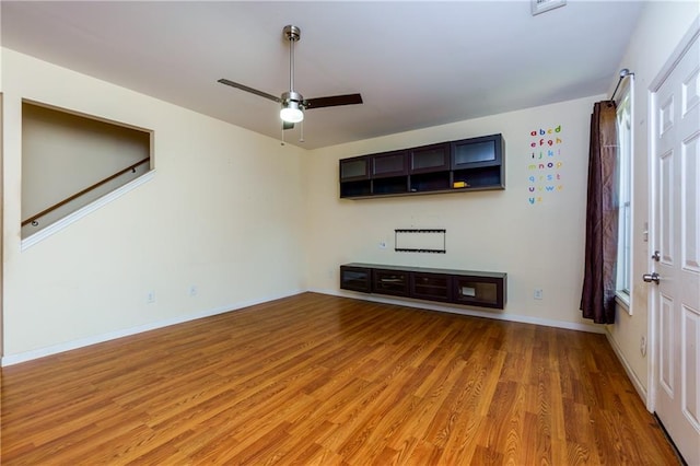 unfurnished living room with ceiling fan and light hardwood / wood-style flooring