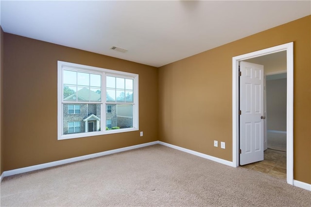 view of carpeted spare room