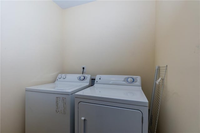 laundry area with separate washer and dryer