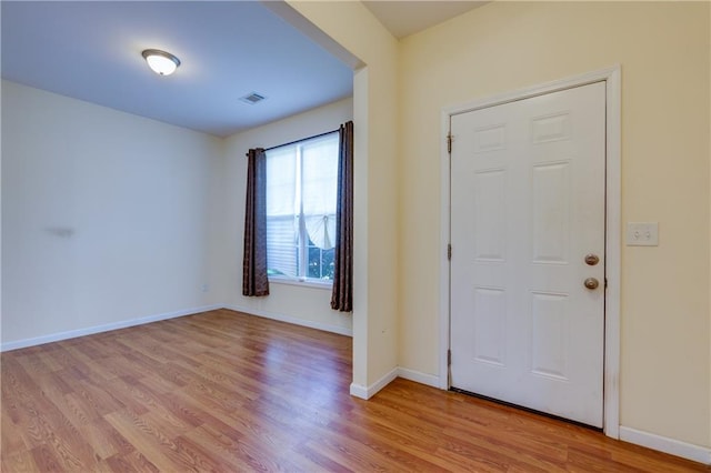 entrance foyer with light hardwood / wood-style flooring