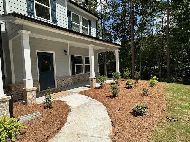 entrance to property with covered porch