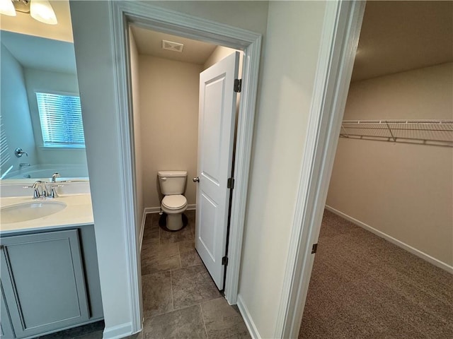 4005 Riverchess Dr SW, Atlanta, GA 30331 - bathroom with vanity, a bathtub, and toilet