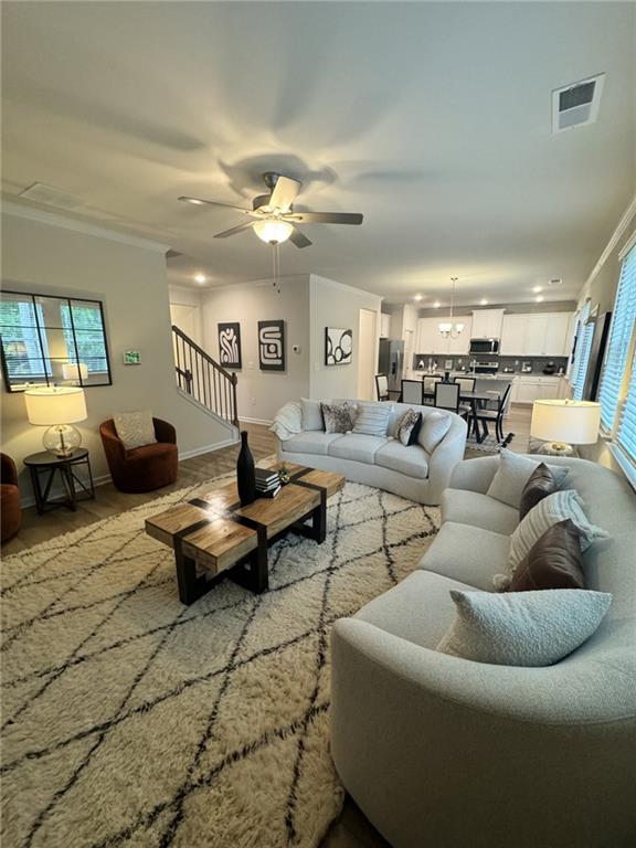 4005 Riverchess Dr SW, Atlanta, GA 30331 - living room with crown molding, ceiling fan, and light hardwood / wood-style floors