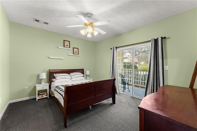 bedroom featuring a textured ceiling, carpet flooring, and access to outside