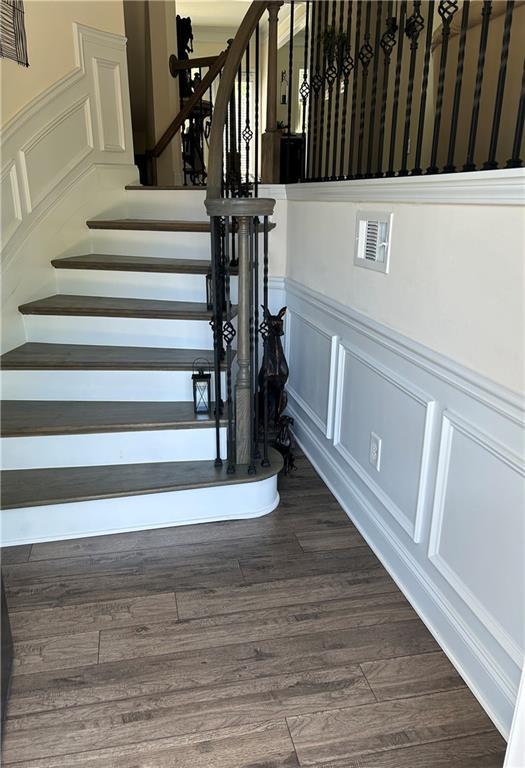 staircase featuring hardwood / wood-style flooring