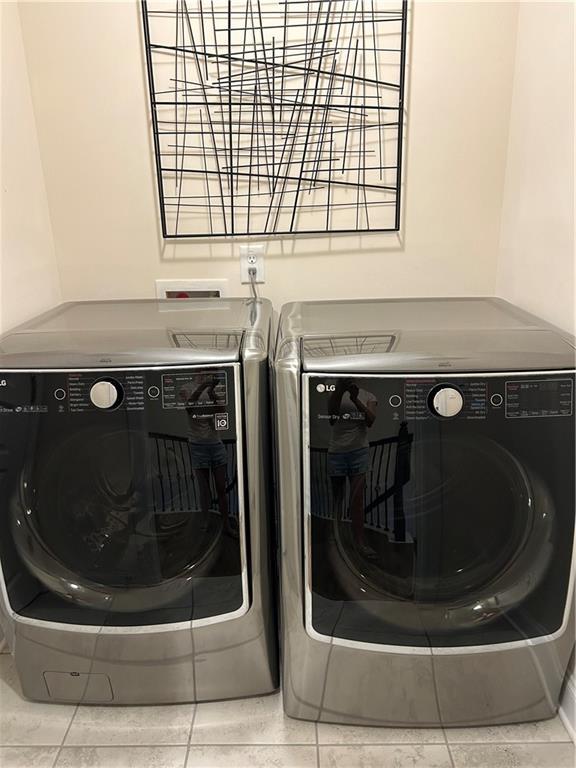 washroom with separate washer and dryer