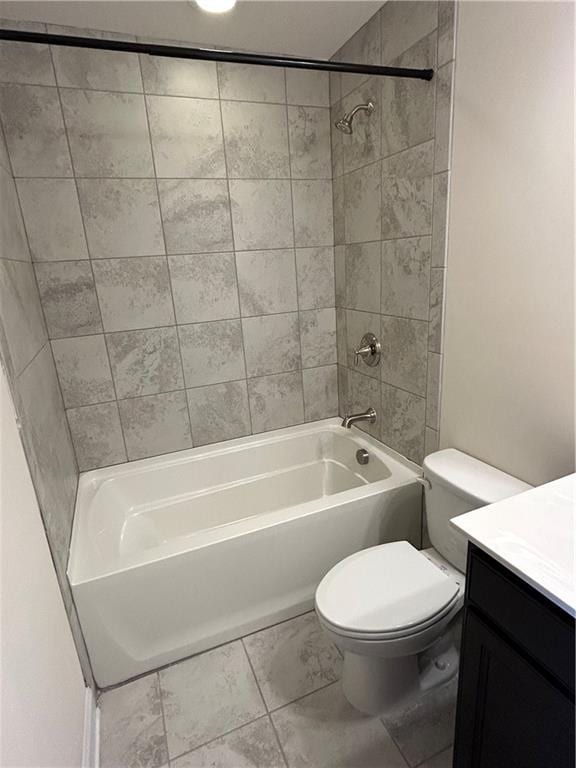 full bathroom with tiled shower / bath combo, toilet, and vanity