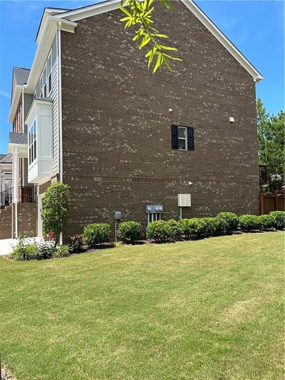 view of property exterior with a yard