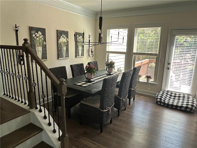 dining room featuring dark hardwood / wood-style floors and crown molding