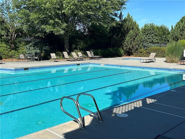 view of swimming pool with a patio