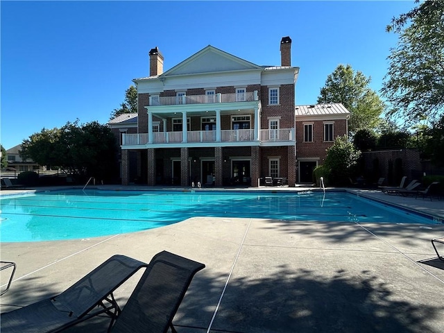 view of pool featuring a patio area