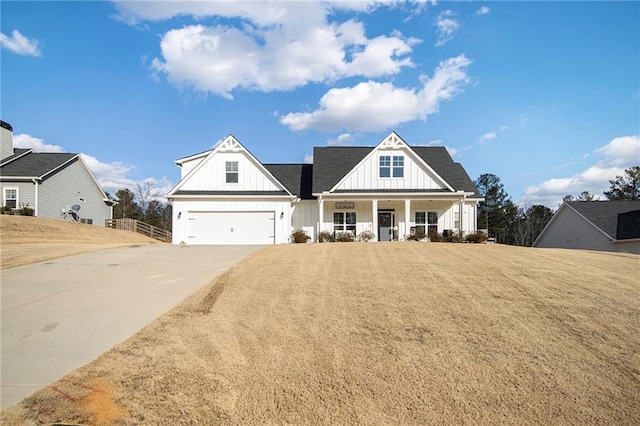 view of front of house with a garage and a front lawn