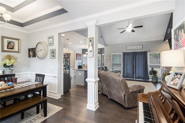 living room featuring ceiling fan, ornamental molding, dark hardwood / wood-style floors, and decorative columns