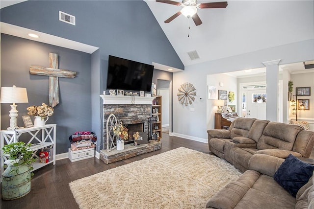 living room featuring ornate columns, high vaulted ceiling, a fireplace, ceiling fan, and dark wood-type flooring