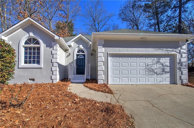 ranch-style home featuring a garage