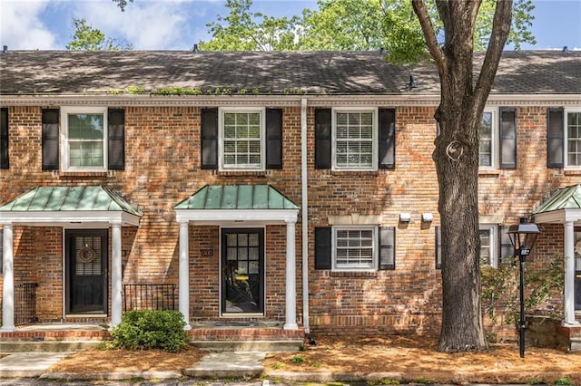 6700 Roswell Rd Unit 21E, Sandy Springs, GA 30328 - multi unit property with brick siding, a standing seam roof, and roof with shingles