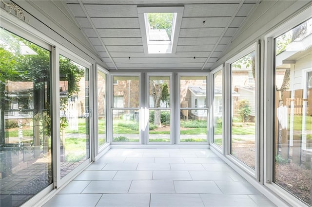 6700 Roswell Rd Unit 21E, Sandy Springs, GA 30328 - unfurnished sunroom with a skylight, plenty of natural light, lofted ceiling, and tile patterned flooring