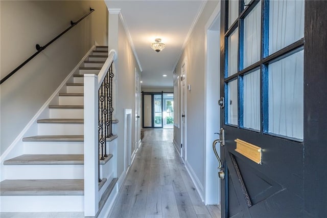 6700 Roswell Rd Unit 21E, Sandy Springs, GA 30328 - foyer entrance featuring light wood finished floors, stairs, and crown molding