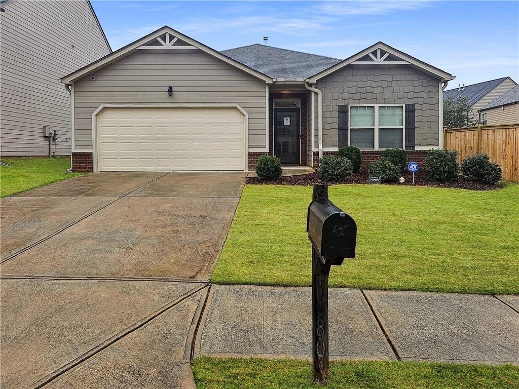 view of front facade with a front lawn and a garage