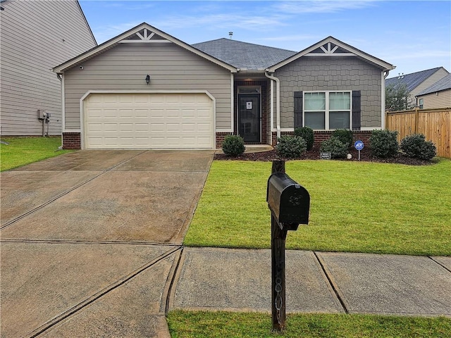 view of front facade with a front lawn and a garage