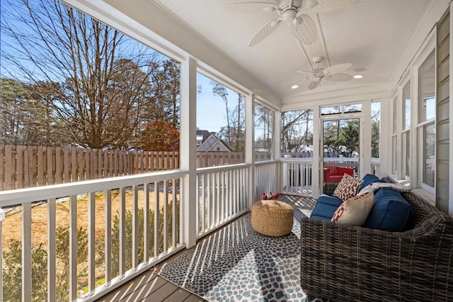 sunroom / solarium with a wealth of natural light and ceiling fan