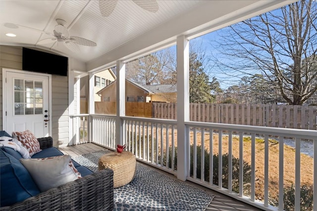 sunroom with a ceiling fan